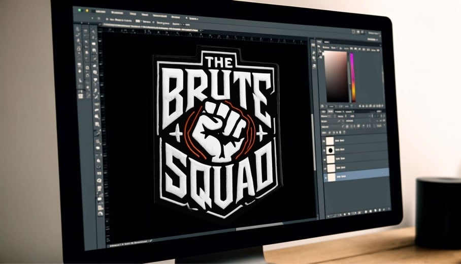 A computer screen displaying a graphic design software with the 'THE BRUTE SQUAD' logo featuring a clenched fist in the center. The design is shown in white text with orange accents on a black background