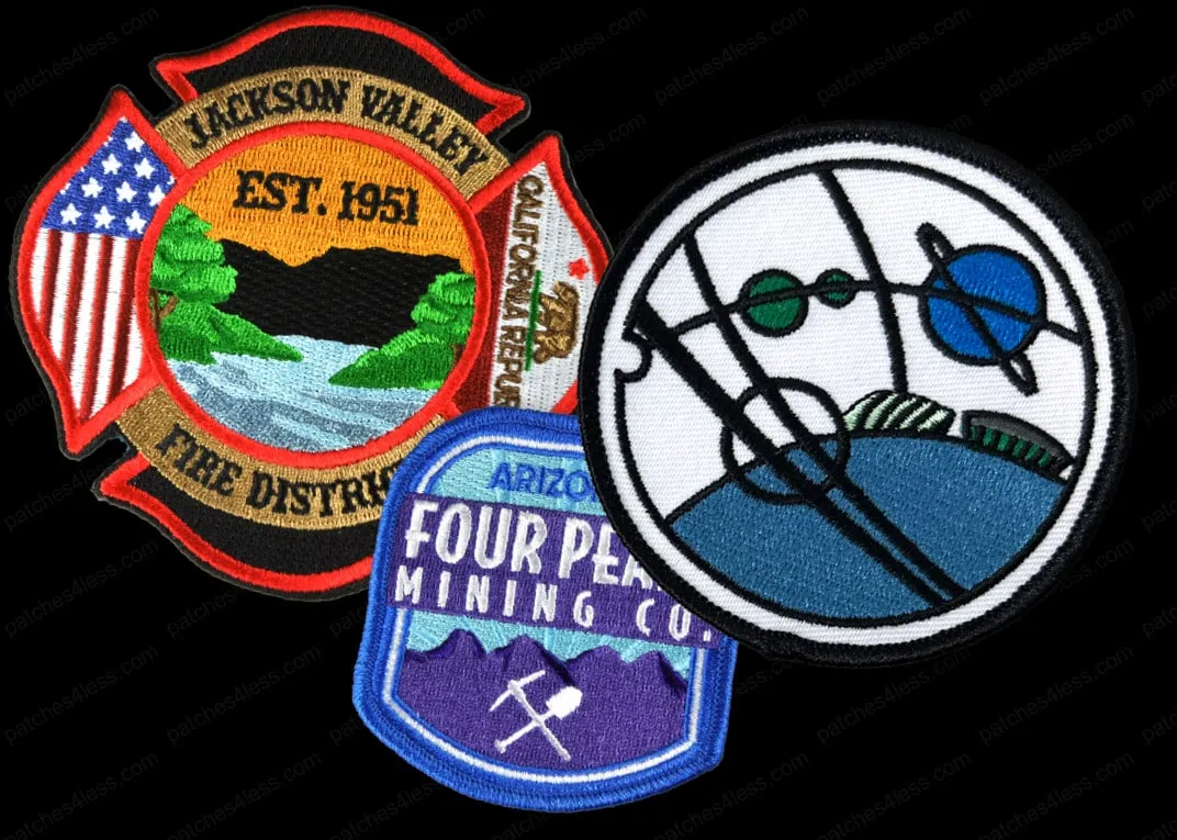 Three embroidered patches: one for Jackson Valley Fire District with American and Californian flags, one with a planet and orbit design, and one for Arizona Four Peaks Mining Co.