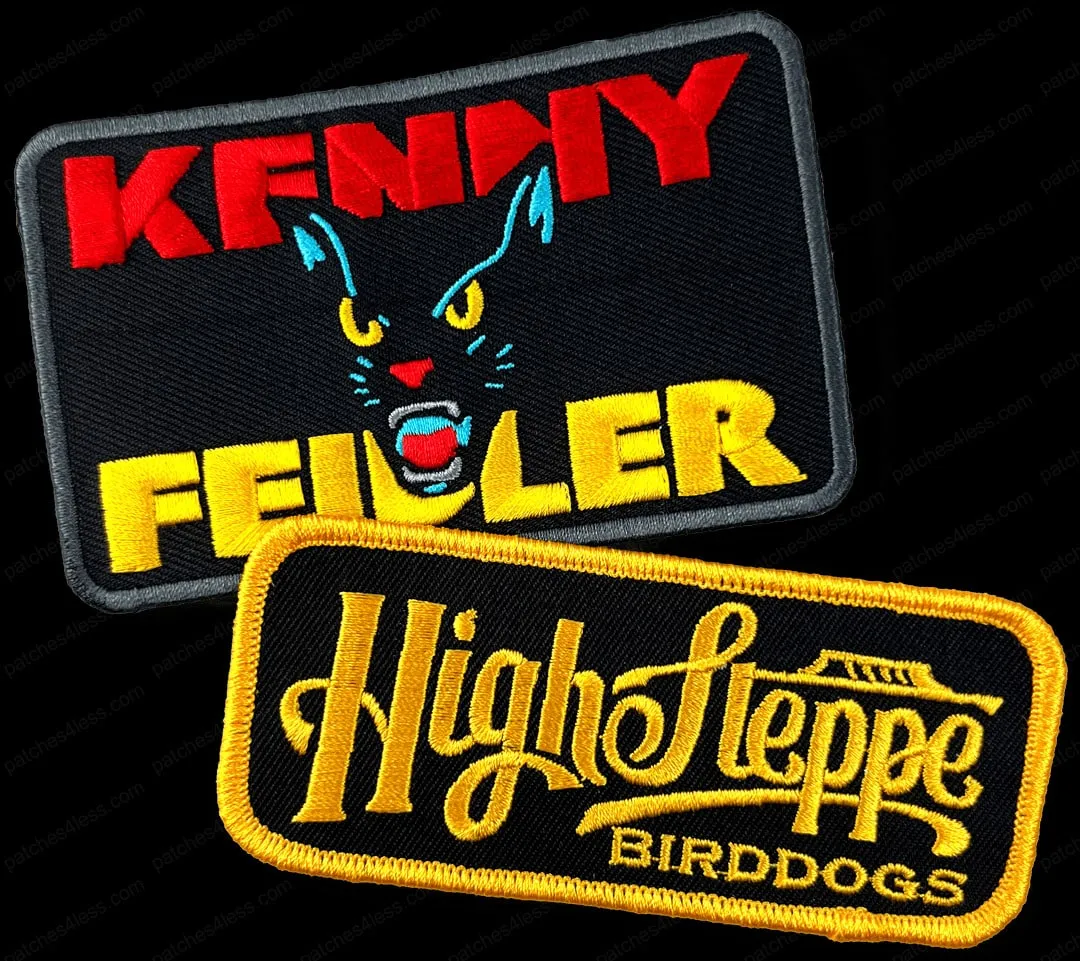 Two band patches. One is a rectangular patch with a black cat face and the text 'Kenny Feiler' in red and yellow. The other is a rectangular patch with a yellow border and the text 'High Steppe Birddogs' in yellow.