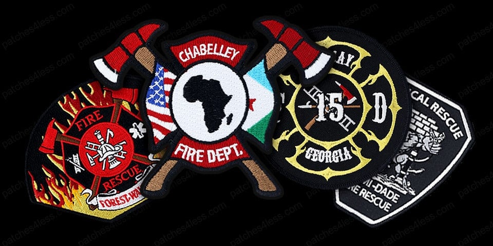 A collection of five fire department patches. Features include a red fire rescue emblem with flames, a shield with axes and the text 'Chabelley Fire Dept.', a circular patch with the text '15 AR Georgia', and a black and white patch with the text 'Miami-Dade Technical Rescue'.