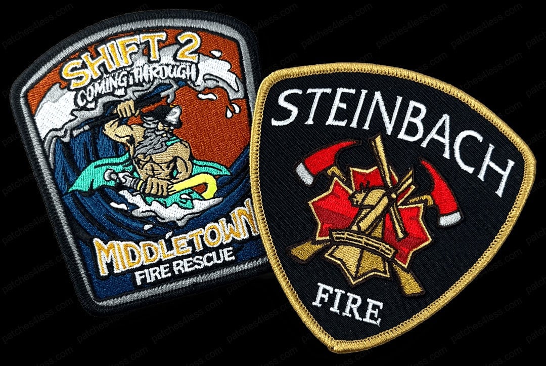 Two fire department patches. One features a muscular figure holding a trident with waves in the background and the text 'Shift 2 Coming Through Middletown Fire Rescue'. The other is a shield-shaped patch with two crossed axes and a fire helmet in front of a red star, with the text 'Steinbach Fire'.