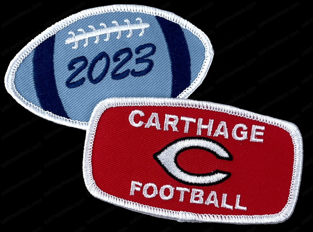 Two football patches. One is shaped like a football with the year '2023' stitched in blue. The other is a red rectangular patch with the text 'Carthage Football' and a white 'C' logo.