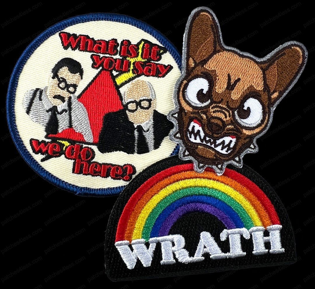Three funny patches. One features two men in suits with the text 'What is it you say we do here?', another is a caricature of an angry dog, and the third is a rainbow with the word 'WRATH' below it.
