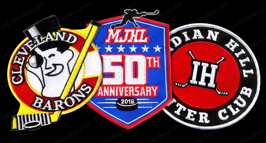 Three hockey patches. One features a smiling man in a top hat with the text 'Cleveland Barons', another is a shield-shaped patch with 'MJHL 50th Anniversary 2016', and the third is a circular patch with 'Indian Hill Winter Club' and the letters 'IH' with two hockey sticks.