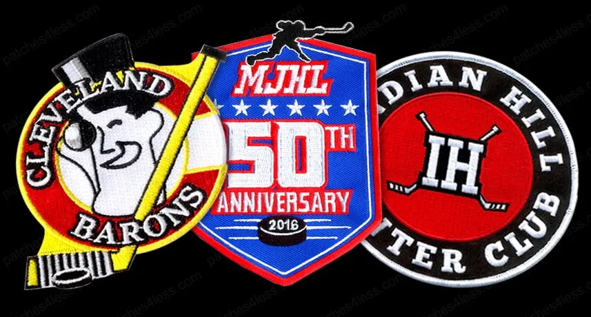 Three hockey patches. One features a smiling man in a top hat with the text 'Cleveland Barons', another is a shield-shaped patch with 'MJHL 50th Anniversary 2016', and the third is a circular patch with 'Indian Hill Winter Club' and the letters 'IH' with two hockey sticks.