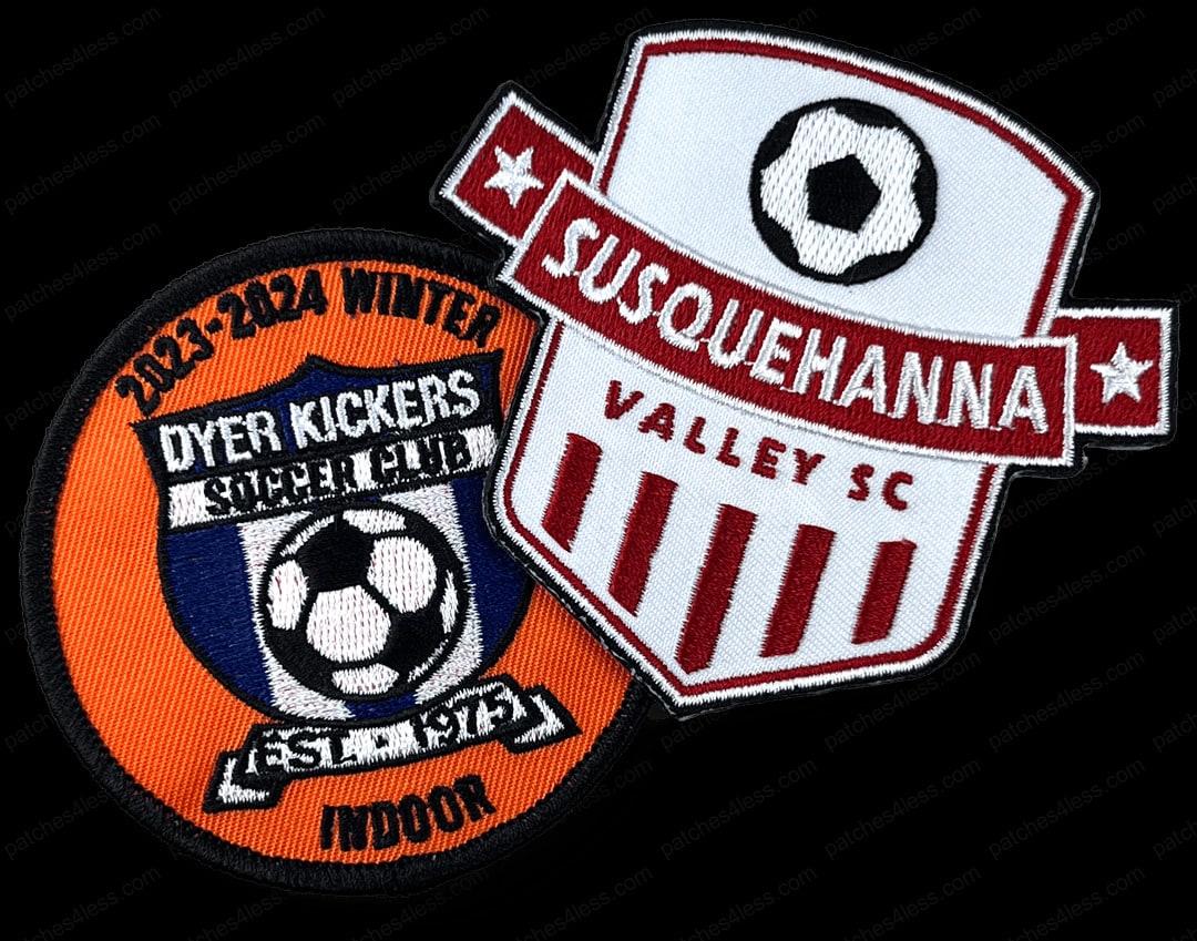 Two soccer club patches. One is a circular patch with the text '2023-2024 Winter Dyer Kickers Soccer Club Indoor Est. 1974' and a soccer ball. The other is a shield-shaped patch with a soccer ball and the text 'Susquehanna Valley SC'.